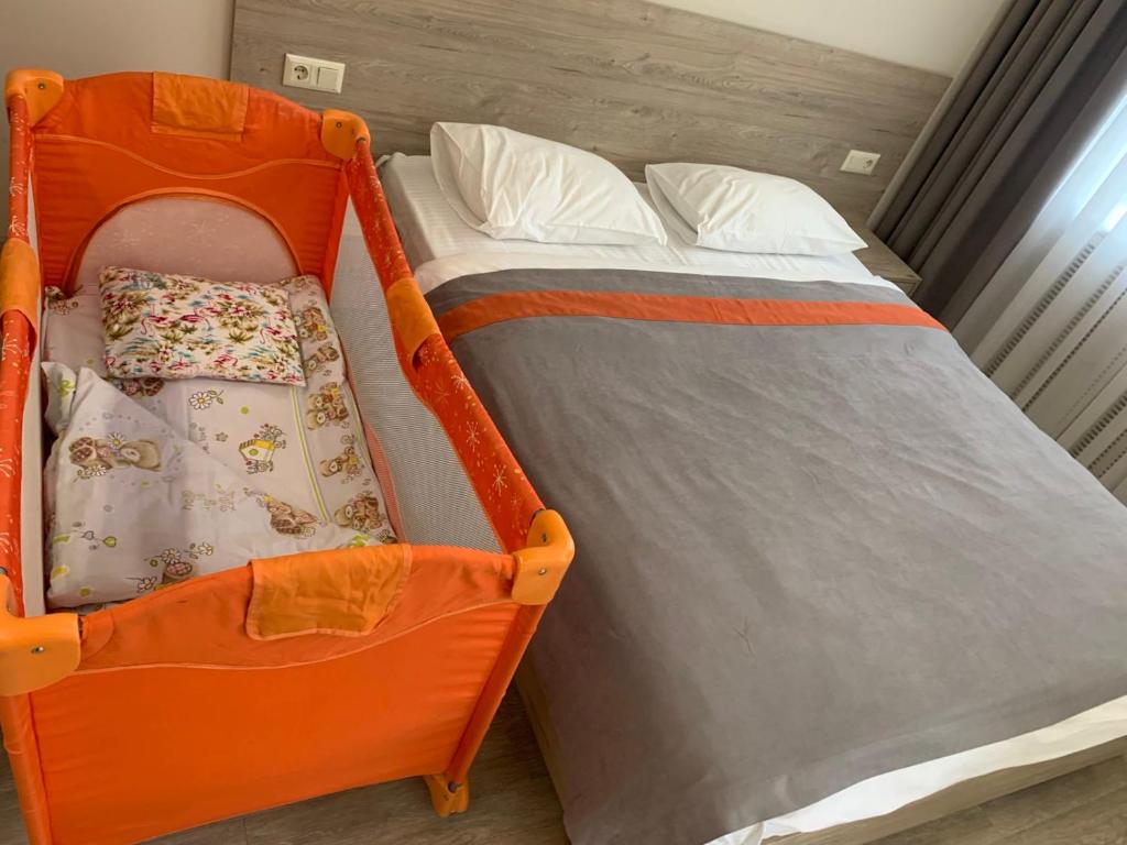 Postel nebo postele na pokoji v ubytování Arena Summit Apart Hotel