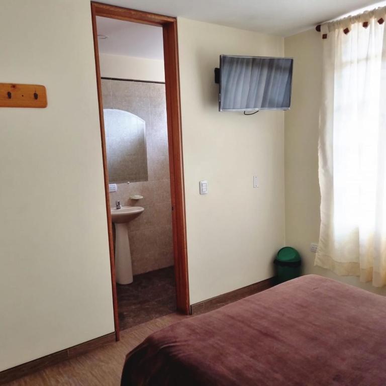Postel nebo postele na pokoji v ubytování Hotel Susagua
