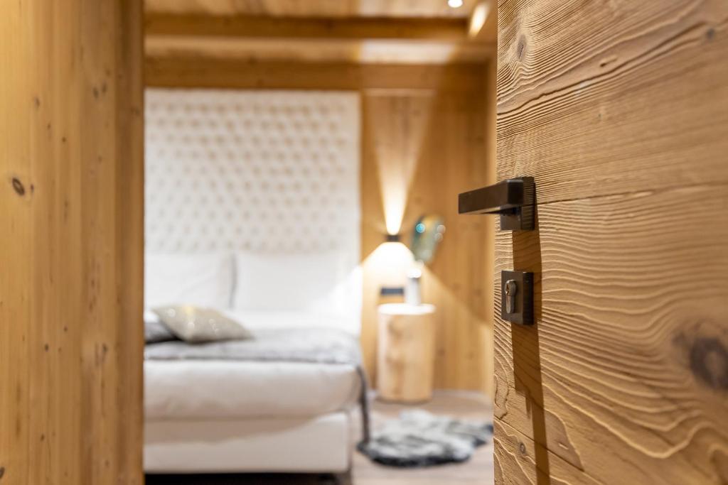 Letto o letti in una camera di Chalet Imbosc'ché - 5 beautiful rooms in charming B&B