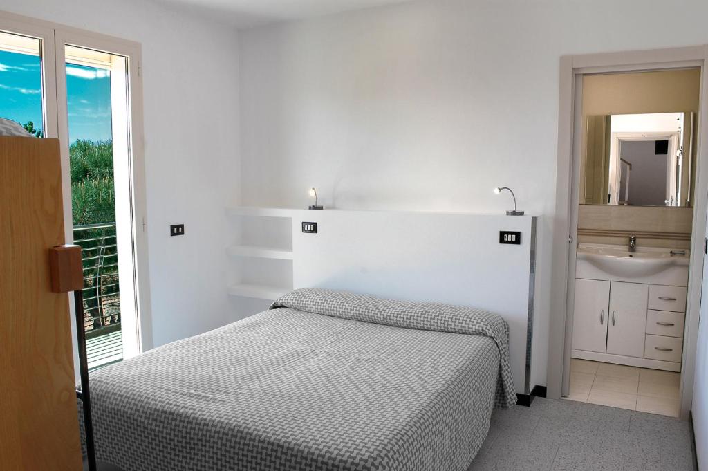 Postel nebo postele na pokoji v ubytování Hotel Marbella