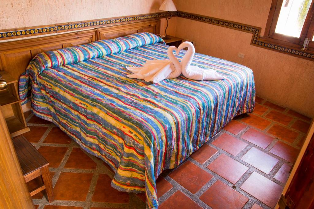 Postel nebo postele na pokoji v ubytování Hotel CasaMia