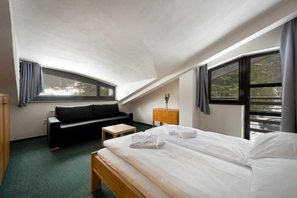Postel nebo postele na pokoji v ubytování Hotel Bohemia