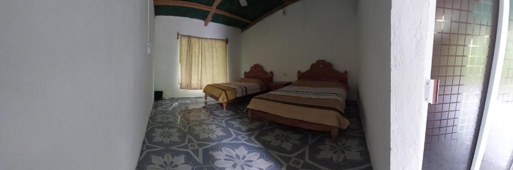Postel nebo postele na pokoji v ubytování Cabaña Sak Ja Selva Lacandona