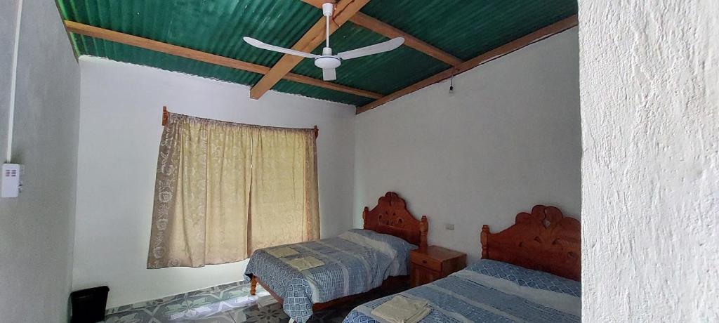 Postel nebo postele na pokoji v ubytování Cabaña Sak Ja Selva Lacandona
