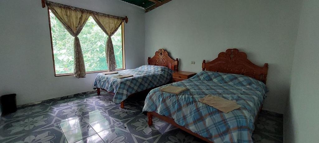 Postel nebo postele na pokoji v ubytování Cabaña Sak Ja Selva Lacandona