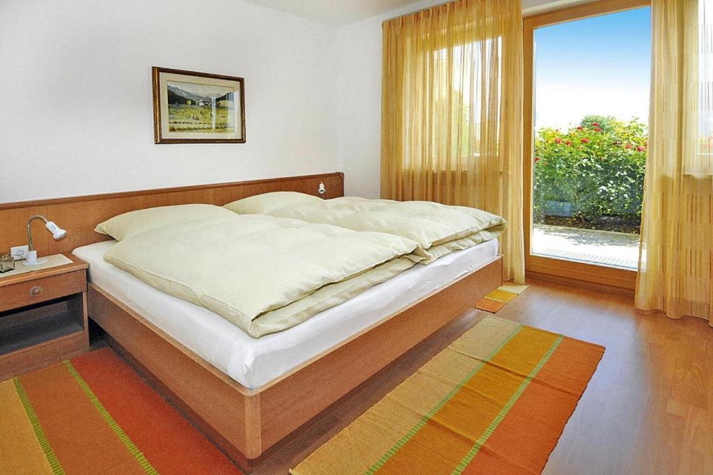 Postel nebo postele na pokoji v ubytování Apartment in Schlanders near Stelvio Park