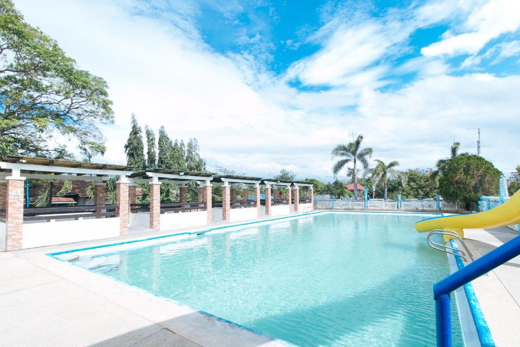 a swimming pool at a resort with at Reddoorz @ Royal Grande Beach Resort Batangas in Batangas City