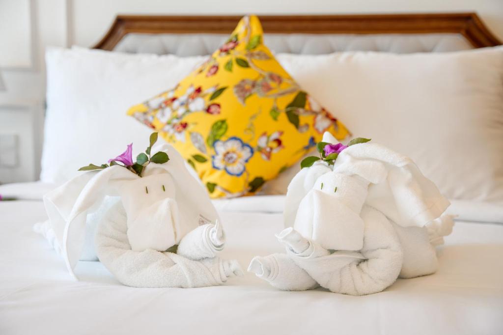 Postel nebo postele na pokoji v ubytování Maison Fleur Luxury Hoi An