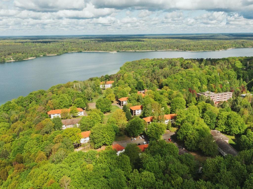 an aerial view of a house next to a river at seezeit-resort am Werbellinsee in Joachimsthal