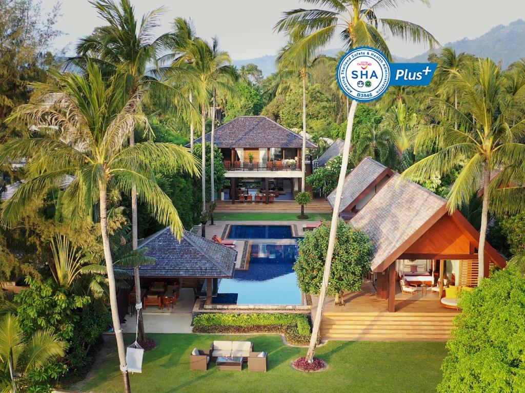 an aerial view of a villa with a swimming pool at Baan Puri - SHA Extra Plus in Lipa Noi