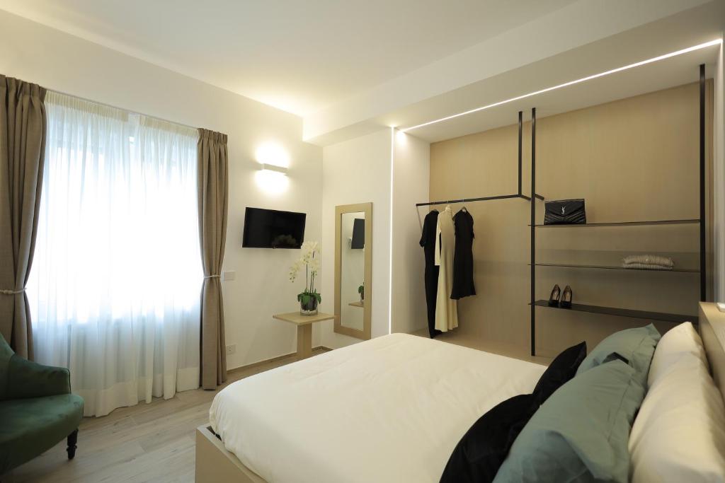 Televízia a/alebo spoločenská miestnosť v ubytovaní Gonzaga Guest House