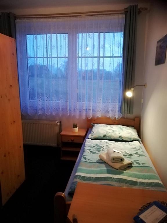 Postel nebo postele na pokoji v ubytování Pension Pastis