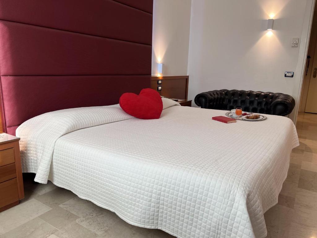 Postel nebo postele na pokoji v ubytování Venice Hotel