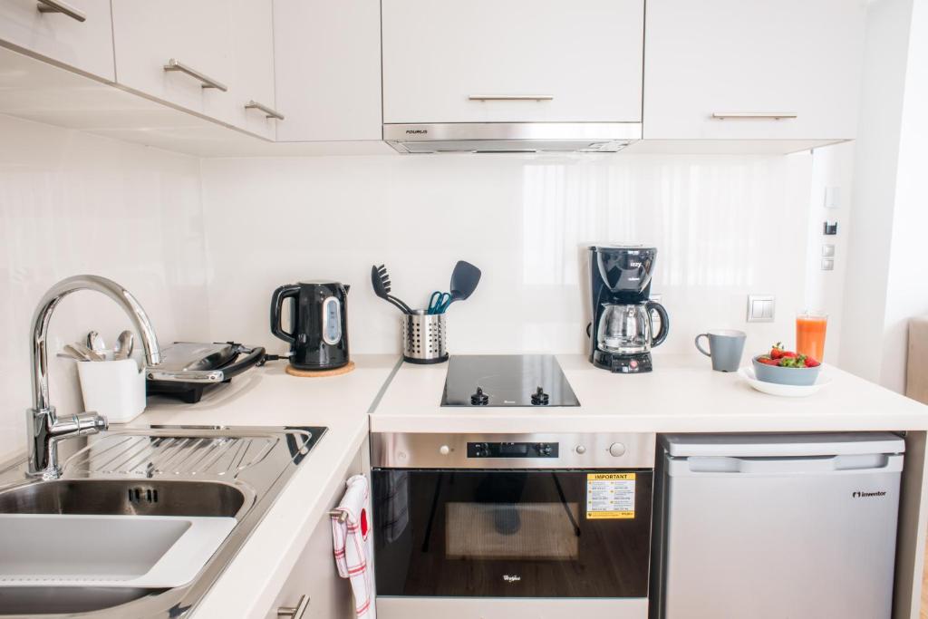 A kitchen or kitchenette at A23 Premium suite with balcony near Parthenon