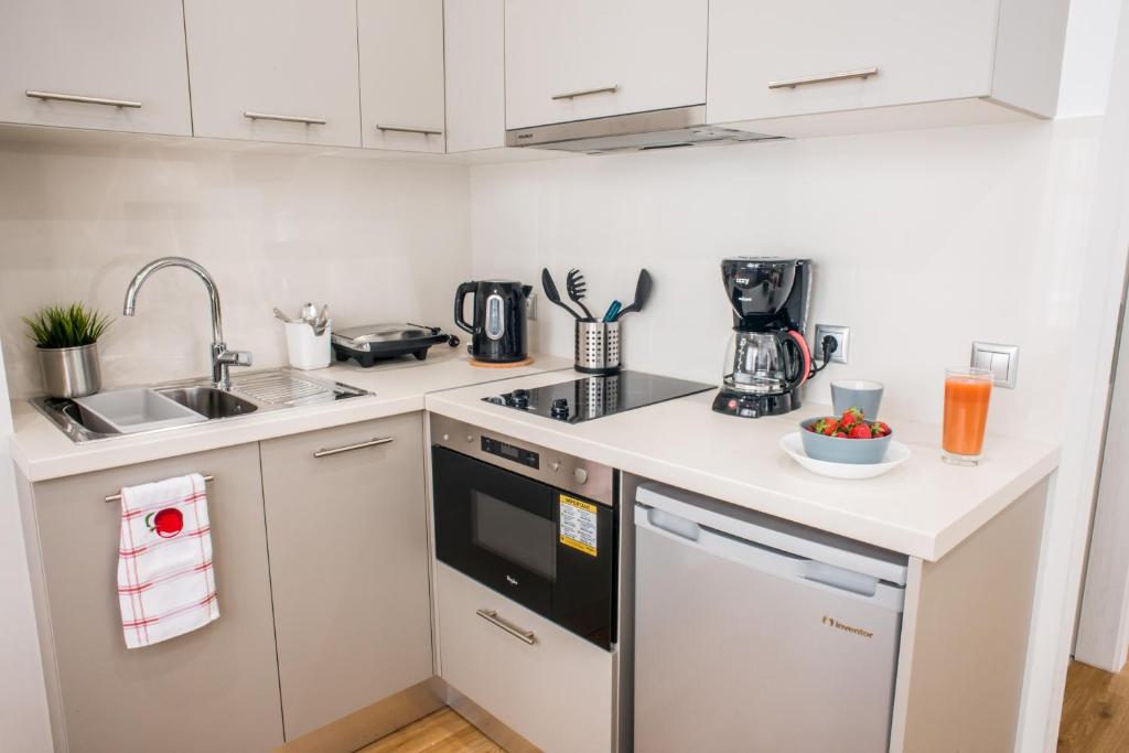 A kitchen or kitchenette at A23 Premium suite with balcony near Parthenon