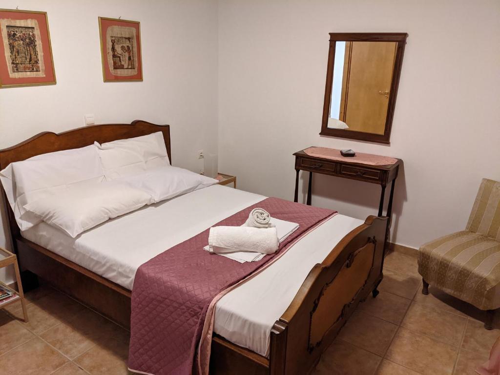 Postel nebo postele na pokoji v ubytování House of Polymnia