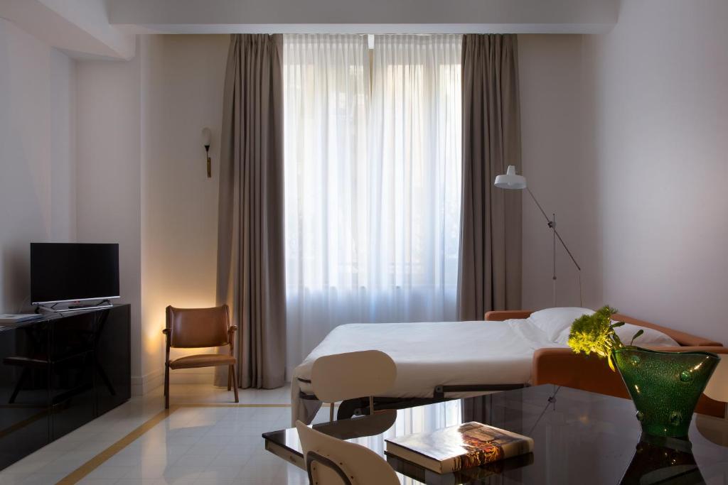 Telewizja i/lub zestaw kina domowego w obiekcie Corso Novara 5 Design Apartments