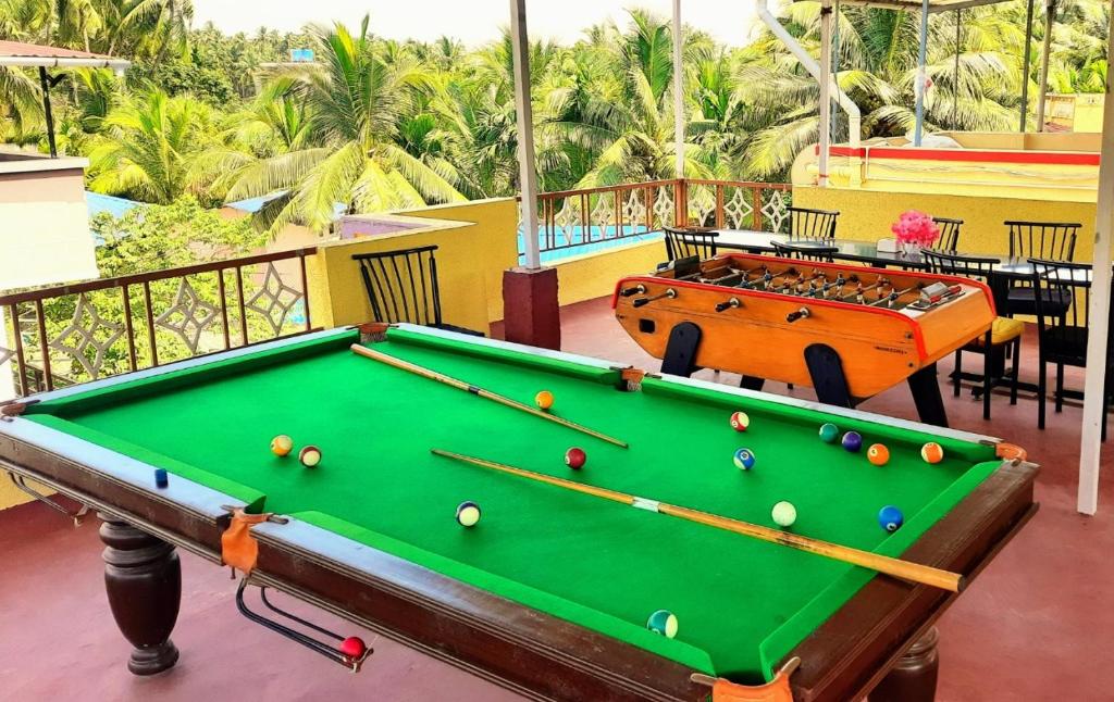 a pool table in a room with a pool table at Swarg 5Bhk Villa Alibaug in Alibaug