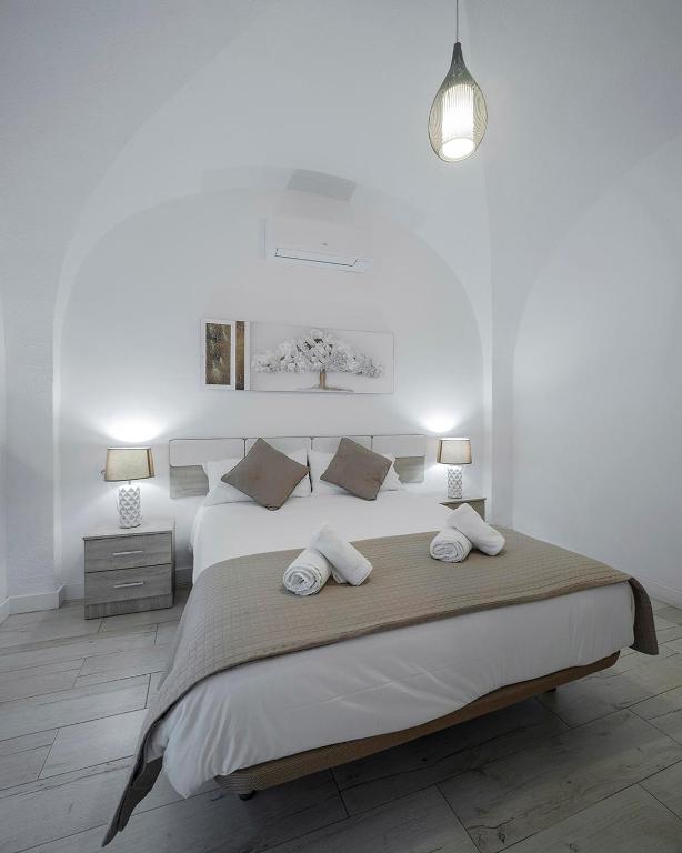 Postel nebo postele na pokoji v ubytování Apartamentos Gladiador