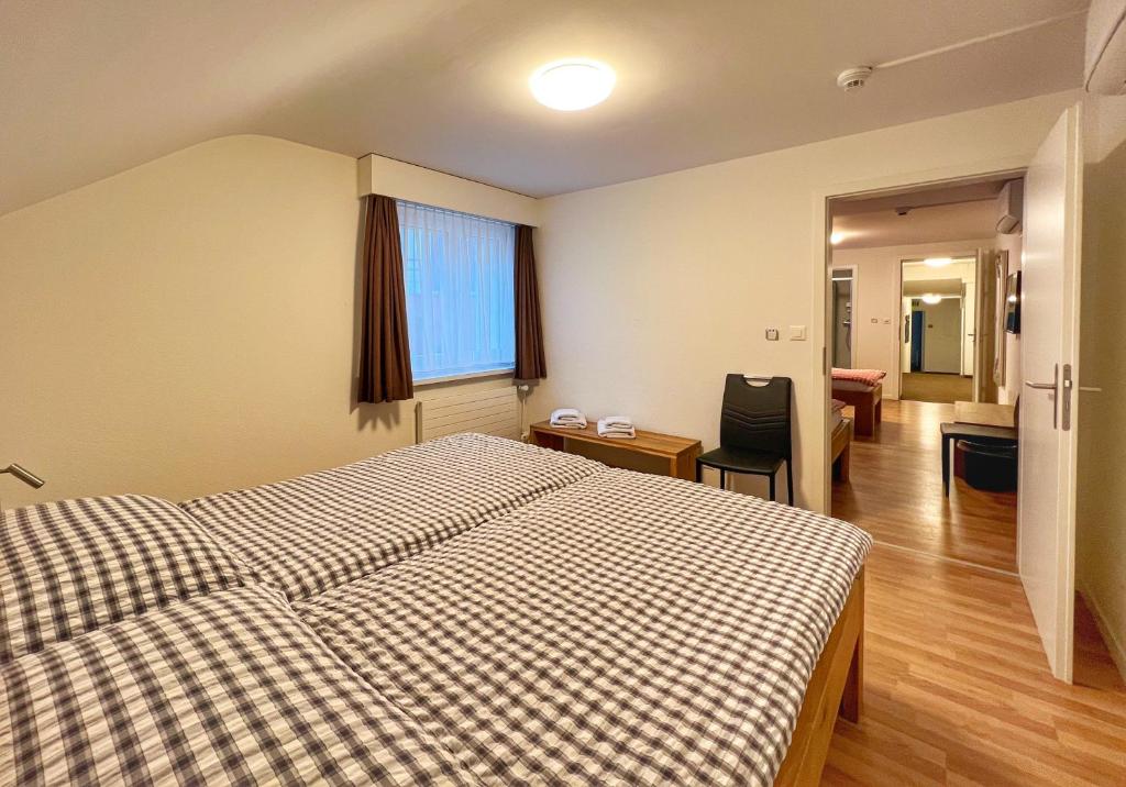 Postel nebo postele na pokoji v ubytování Hotel Hecht