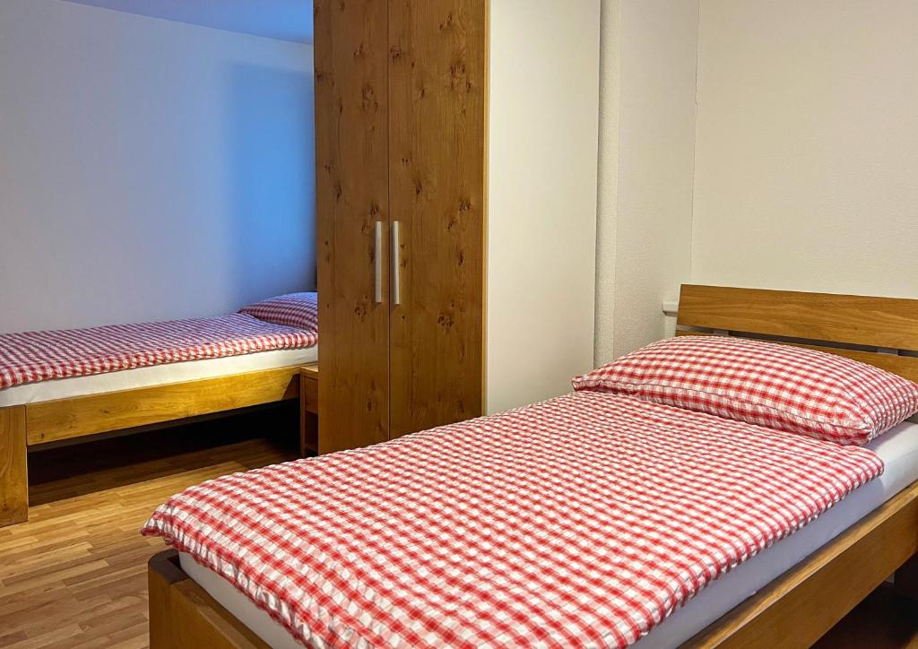 Postel nebo postele na pokoji v ubytování Hotel Hecht