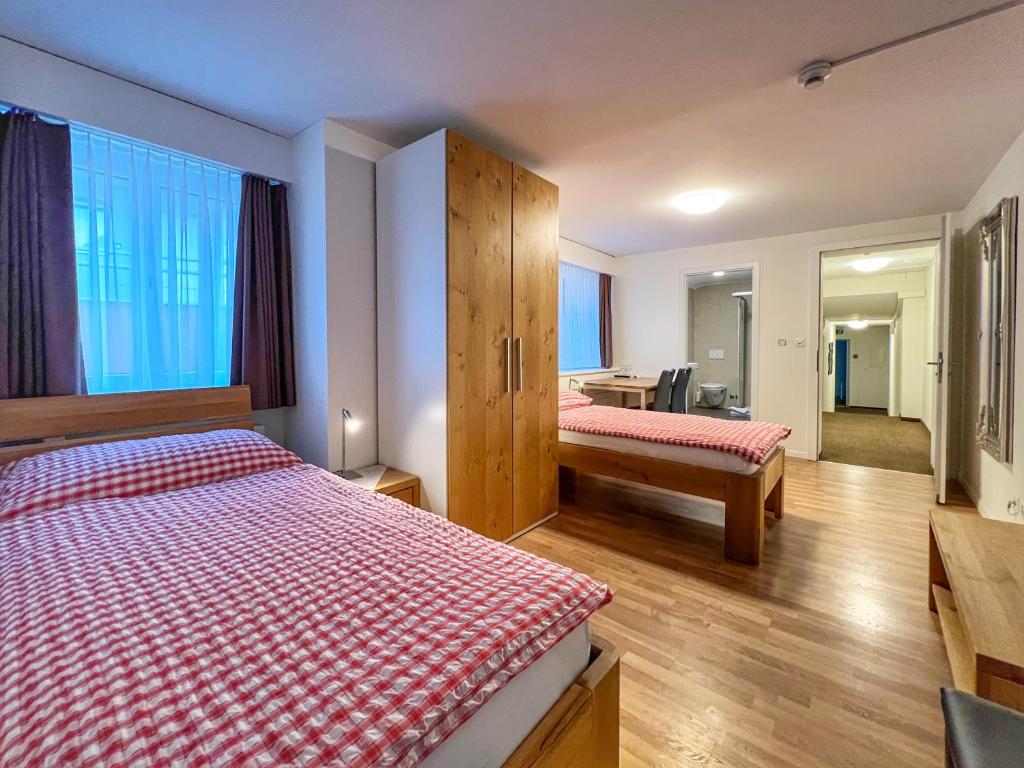 Postel nebo postele na pokoji v ubytování Hotel Hecht