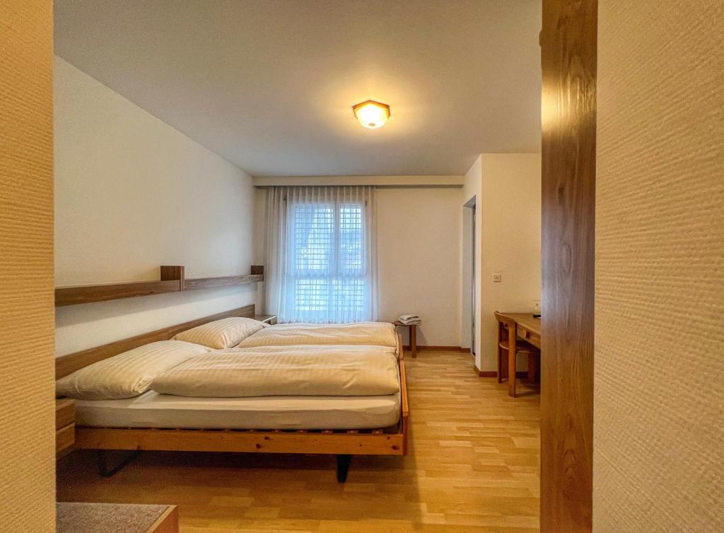 Postel nebo postele na pokoji v ubytování Hotel Hecht