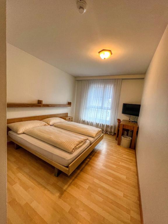 Postel nebo postele na pokoji v ubytování Hotel Hecht