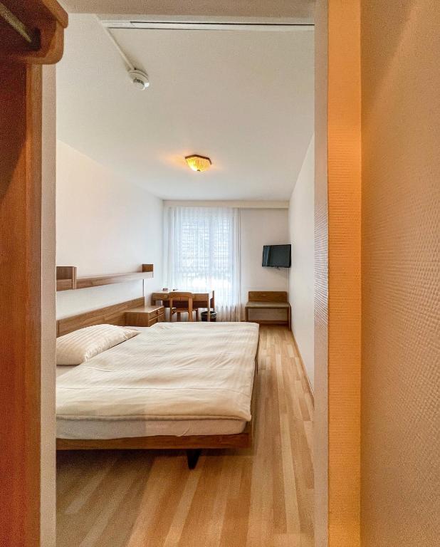 Postel nebo postele na pokoji v ubytování Hotel Hecht
