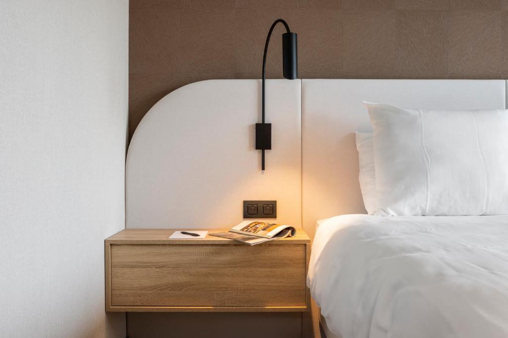 Postel nebo postele na pokoji v ubytování Van der Valk Hotel Gent