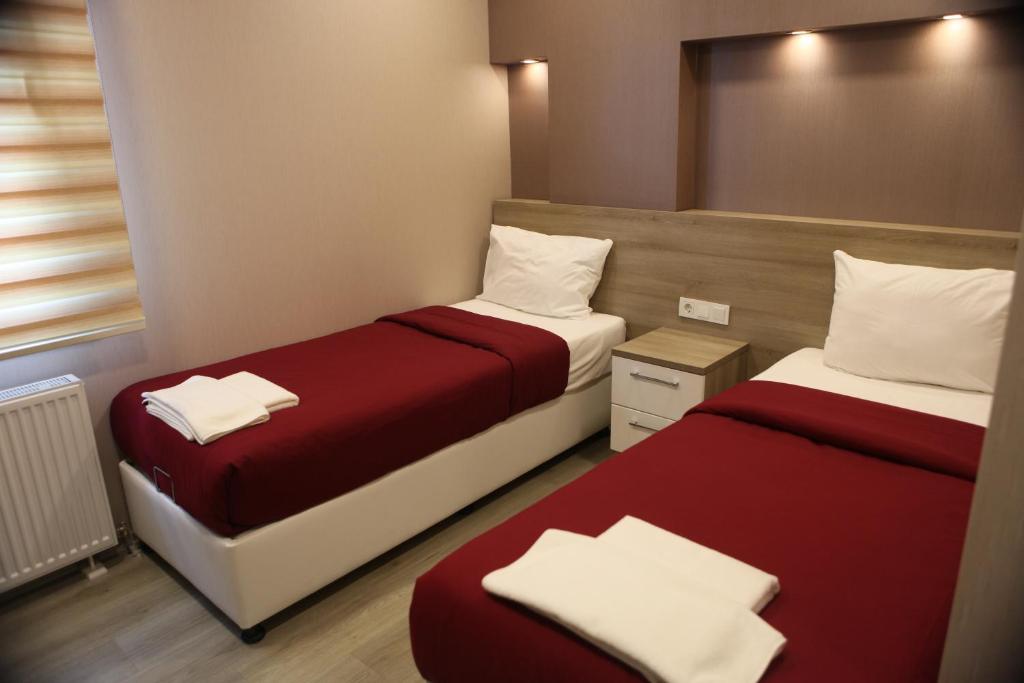 En eller flere senge i et værelse på Ucar Royal Hotel ve Konferans Salonu