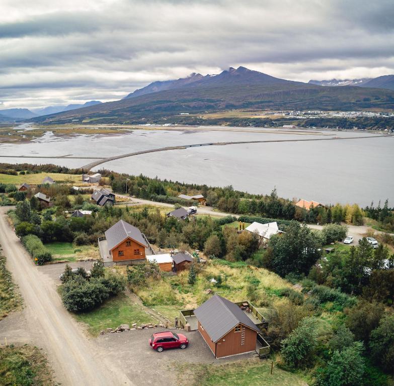 an aerial view of a small town with a lake at Björkin – Cozy Cabin with excellent view in Akureyri