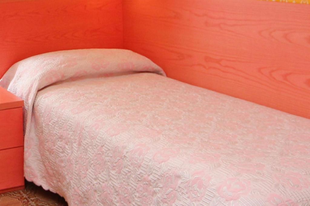Postel nebo postele na pokoji v ubytování Hotel Benaco