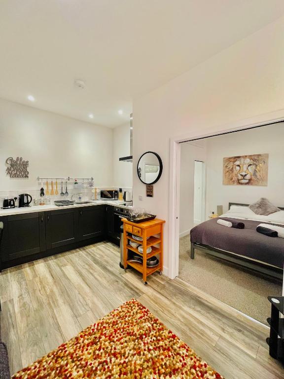 a bedroom with a bed and a bathroom with a sink at Holgate hideout in York