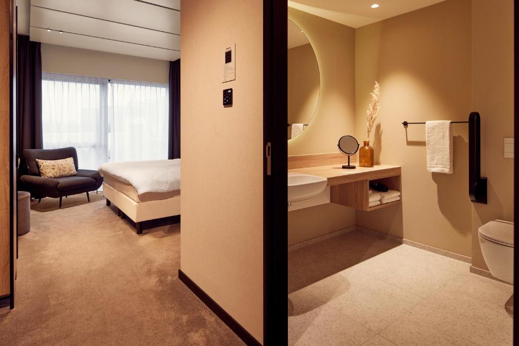 Postel nebo postele na pokoji v ubytování Van der Valk Hotel Gent