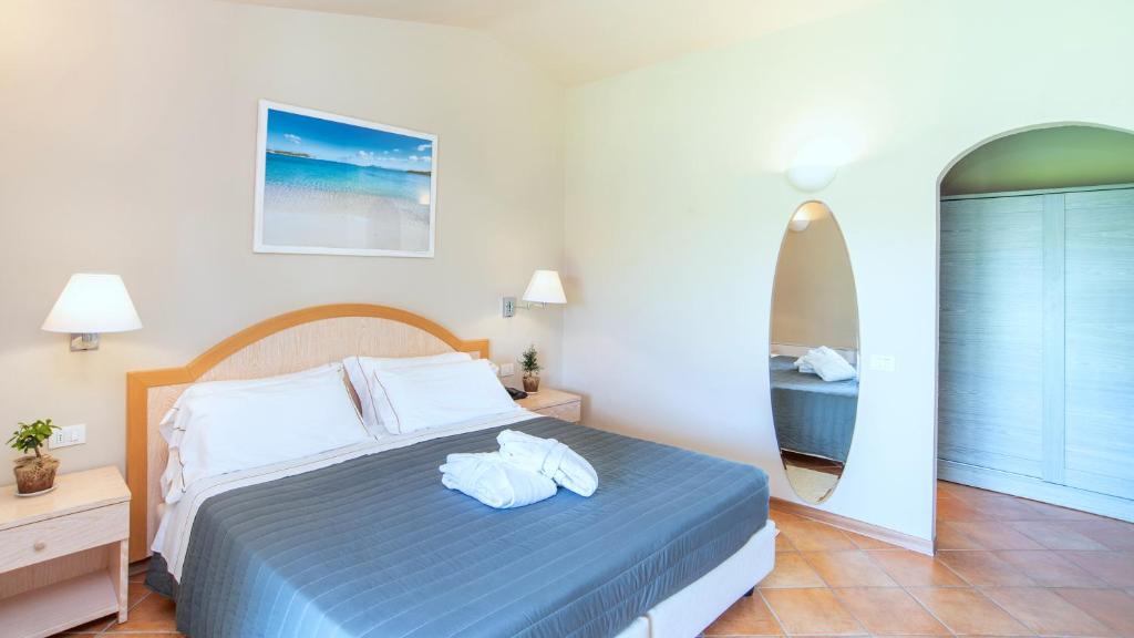 Postel nebo postele na pokoji v ubytování Hotel Nibaru