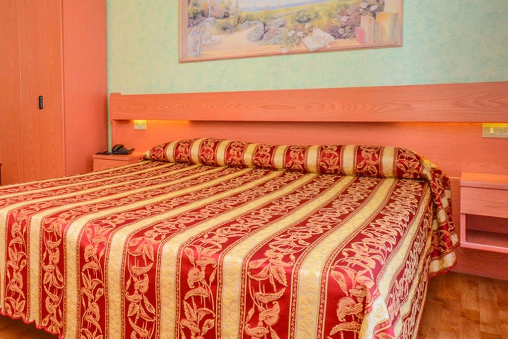 Postel nebo postele na pokoji v ubytování Hotel Benaco