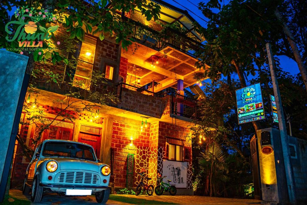 an old car parked in front of a building at THURU VILLA in Katunayaka