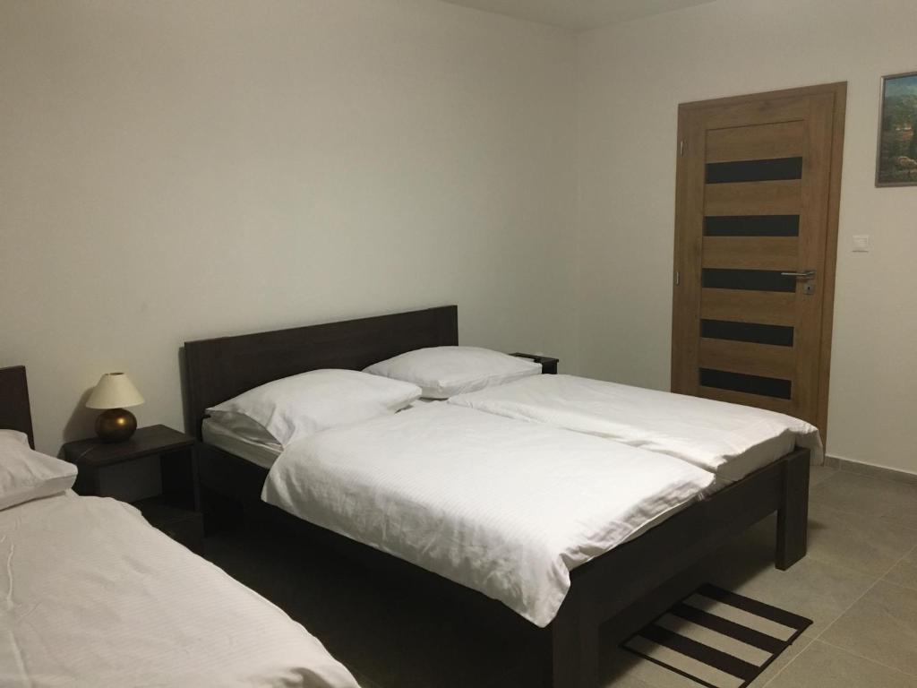 Postel nebo postele na pokoji v ubytování Podhájska - Holiday