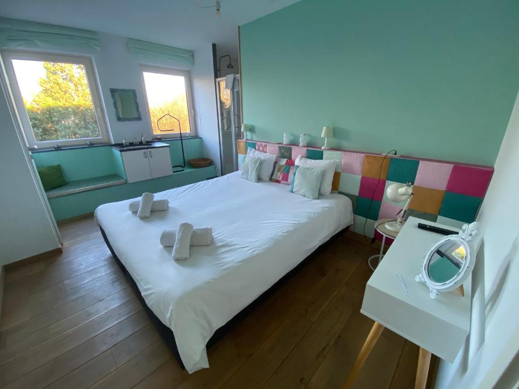 Un ou plusieurs lits dans un hébergement de l'établissement Maison Jules