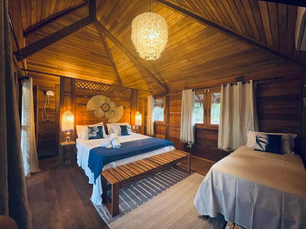 Postel nebo postele na pokoji v ubytování Pousada Casa Caju Bangalows