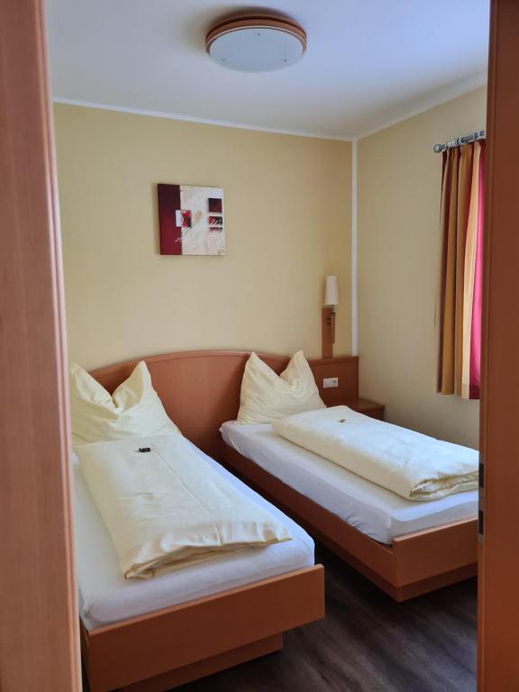 Postel nebo postele na pokoji v ubytování Hotel Stocker