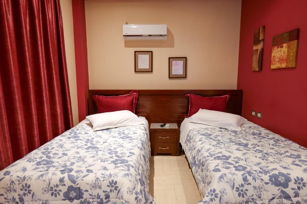 Postel nebo postele na pokoji v ubytování Hotel Lindi