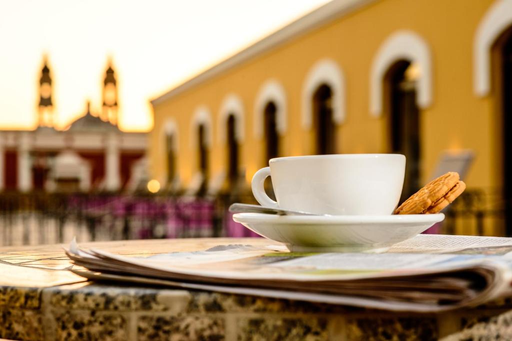 a coffee cup sitting on top of a table at Hotel Plaza Campeche in Campeche