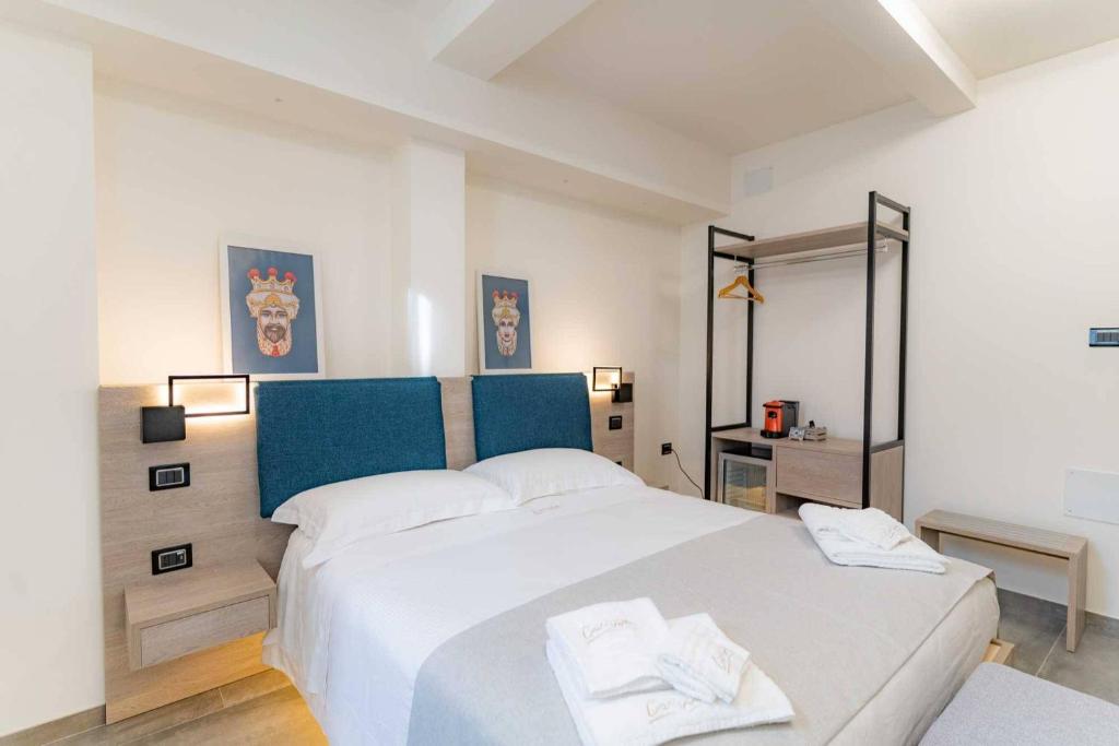 Postel nebo postele na pokoji v ubytování Carizza Rooms