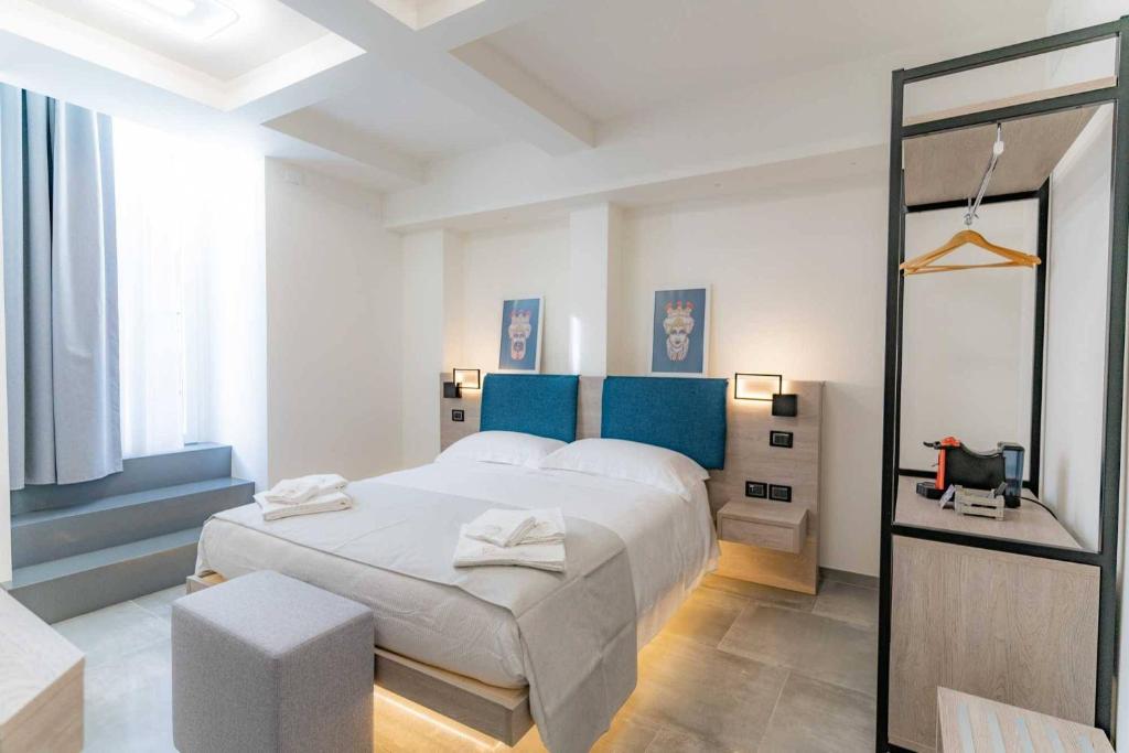 Postel nebo postele na pokoji v ubytování Carizza Rooms