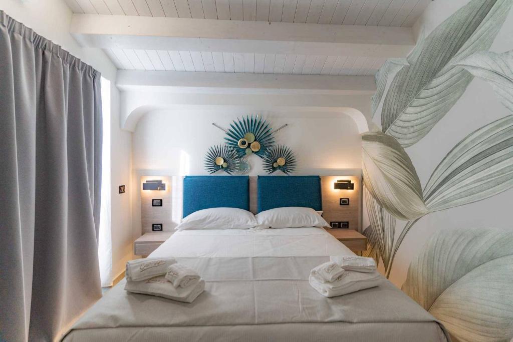 Postel nebo postele na pokoji v ubytování Carizza Rooms