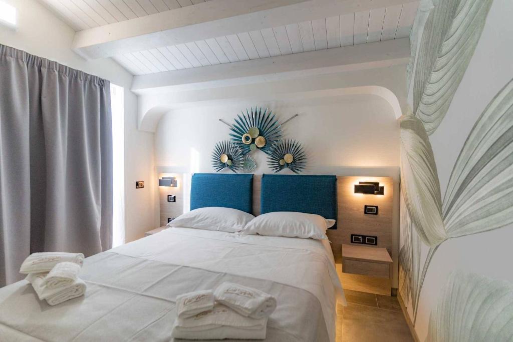 Postel nebo postele na pokoji v ubytování Carizza Rooms