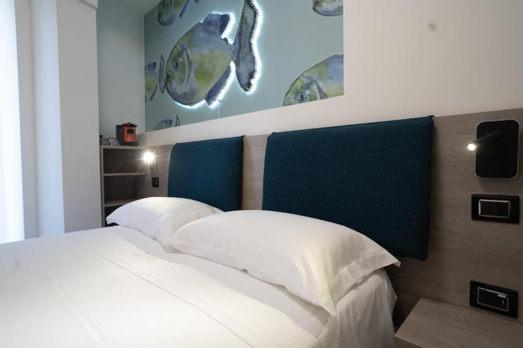 Postel nebo postele na pokoji v ubytování Carizza Rooms