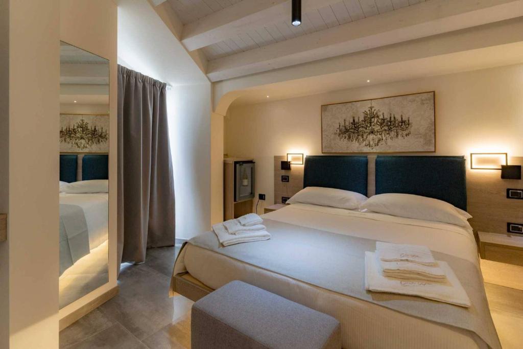 Postel nebo postele na pokoji v ubytování Carizza Rooms